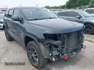 2017 Jeep Grand Cherokee Trailhawk with VIN 1C4RJFLG4HC843628, listed as a IAAI auction lot 42053878 with 83,551 mi miles and . Bid and sale history available at DreamBid. Image 1.