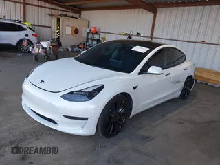 2021 Tesla Model 3 Performance with VIN 5YJ3E1EC4MF097993, listed as a IAAI auction lot 41366615 with 30,735 mi miles and . Bid and sale history available at DreamBid. Image 17.