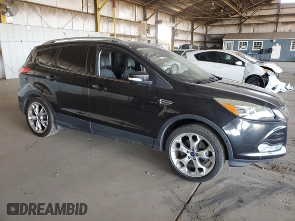 2015 Ford Escape Titanium with VIN 1FMCU0J91FUA17918, listed as a Copart auction lot 64525025 with 130,095 mi miles and Salvage title. Bid and sale history available at DreamBid. Image 4.