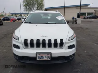 2015 Jeep Cherokee Latitude with VIN 1C4PJLCB0FW761871, listed as a IAAI auction lot 42099336 with 213,049 mi miles and . Bid and sale history available at DreamBid. Image 13.
