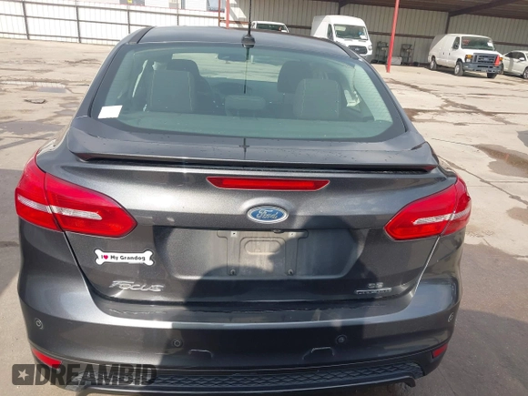 2016 Ford Focus SE z VIN 1FADP3F28GL360512, wystawiony jako IAAI lot #42427723 z przebiegiem 217 172 mil mil oraz . Historia ofert i sprzedaży dostępna na DreamBid. Obrazek 16.