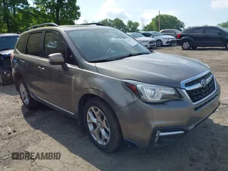 2017 Subaru Forester Touring z VIN JF2SJATC8HH418242, wystawiony jako IAAI lot #42147637 z przebiegiem 130 641 mil mil oraz . Historia ofert i sprzedaży dostępna na DreamBid. Obrazek 1.
