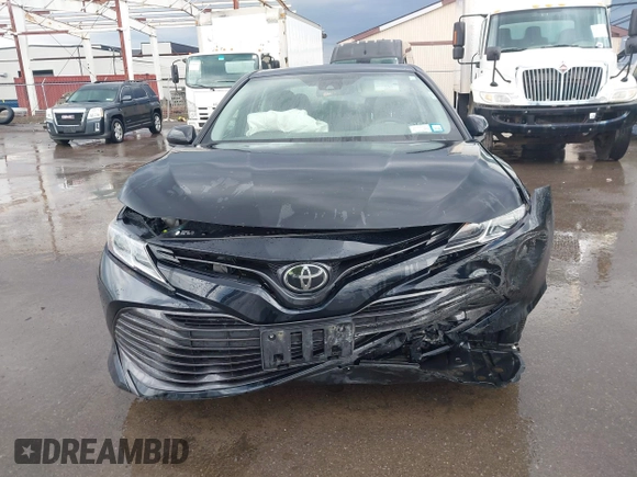 2019 Toyota Camry LE with VIN 4T1B11HK2KU263910, listed as a IAAI auction lot 42060008 with 31,433 mi miles and . Bid and sale history available at DreamBid. Image 6.
