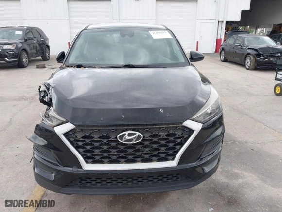 2019 Hyundai Tucson SE with VIN KM8J23A40KU874423, listed as a IAAI auction lot 41858253 with 136,651 mi miles. Bid and sale history available at carsss.com. Image 13.