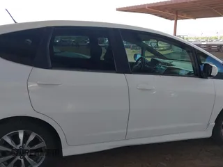 2012 Honda Fit Sport with VIN JHMGE8H55CC000608, listed as a IAAI auction lot 42025275 with 111,621 mi miles. Bid and sale history available at carsss.com. Image 13.