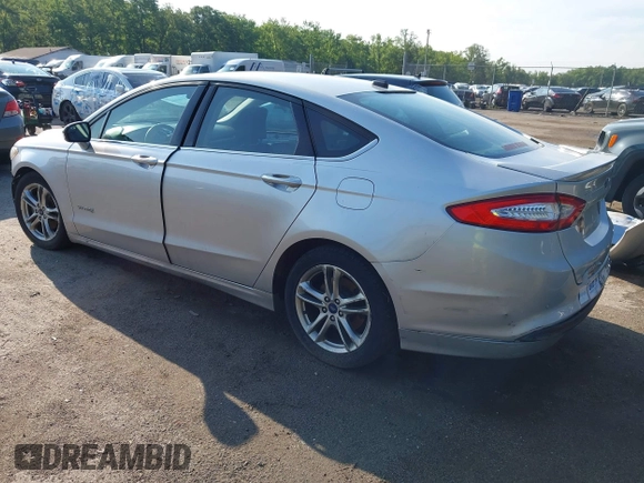 2016 Ford Fusion SE Hybrid z VIN 3FA6P0LU6GR121605, wystawiony jako IAAI lot #42651096 z przebiegiem 194 693 mil mil oraz . Historia ofert i sprzedaży dostępna na DreamBid. Obrazek 3.