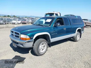 1999 Dodge Dakota SLT with VIN 1B7GG22Y2XS157214, listed as a IAAI auction lot 39776504 with 144,928 mi miles and . Bid and sale history available at carsss.com. Image 2.