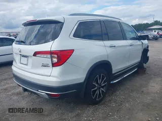 2020 Honda Pilot Elite with VIN 5FNYF6H08LB014288, listed as a IAAI auction lot 40496871 with 57,921 mi miles and . Bid and sale history available at DreamBid. Image 4.