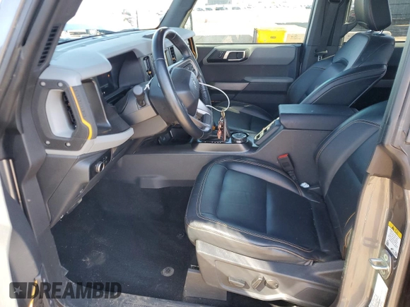 2023 Ford Bronco with VIN 1FMEE5DP0PLC10002, listed as a Copart auction lot 57272555 with 14,035 mi miles and Salvage title. Bid and sale history available at DreamBid. Image 7.