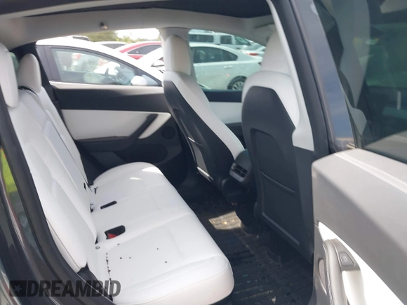 2022 Tesla Model Y Long Range z VIN 7SAYGDEE2NF447998, wystawiony jako IAAI lot #41704968 z przebiegiem 34 088 mil mil oraz . Historia ofert i sprzedaży dostępna na DreamBid. Obrazek 8.