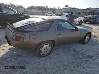 1984 Porsche 928 z VIN WP0JB0927ES862274, wystawiony jako Copart lot #75285934 z przebiegiem 97 509 mil mil oraz Tytuł czysty. Historia ofert i sprzedaży dostępna na DreamBid. Obrazek 3.
