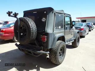 2005 Jeep Wrangler Sport with VIN 1J4FA49S45P345673, listed as a IAAI auction lot 41830128 with 139,432 mi miles. Bid and sale history available at carsss.com. Image 4.