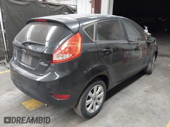 2013 Ford Fiesta SE with VIN 3FADP4EJ1DM107945, listed as a IAAI auction lot 42025064 with Not Provided miles and . Bid and sale history available at DreamBid. Image 4.