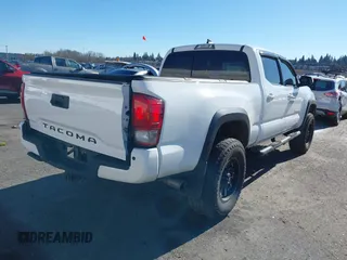 2017 Toyota Tacoma SR5 with VIN 3TMDZ5BN3HM023813, listed as a IAAI auction lot 41522828 with 128,533 mi miles and . Bid and sale history available at DreamBid. Image 4.