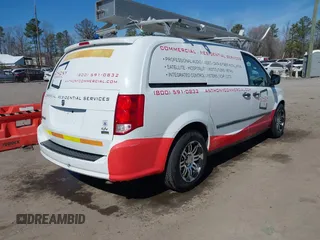 2014 Ram Cargo Van Tradesman with VIN 2C4JRGAG2ER353111, listed as a IAAI auction lot 41667424 with 200,798 mi miles. Bid and sale history available at carsss.com. Image 4.