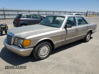 1990 Mercedes-Benz 300 with VIN WDBCA24D1LA529716, listed as a Copart auction lot 56581335 with 122,286 mi miles and Salvage Title. Bid and sale history available at DreamBid. Image 1.