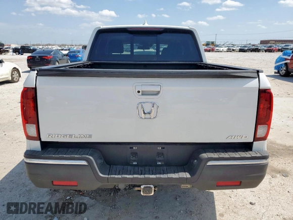 2020 Honda Ridgeline RTL with VIN 5FPYK3F57LB031244, listed as a Copart auction lot 58863795 with 54,318 mi miles and Salvage title. Bid and sale history available at DreamBid. Image 6.