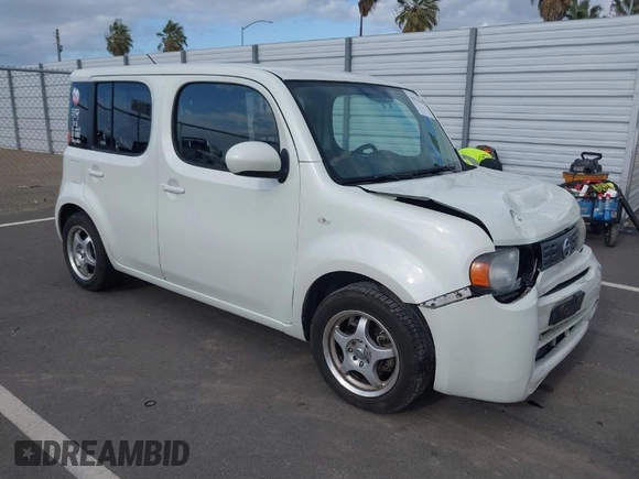 2010 Nissan Cube S z VIN JN8AZ2KRXAT161347, wystawiony jako IAAI lot #41921669 z przebiegiem 161 121 mil mil oraz . Historia ofert i sprzedaży dostępna na DreamBid. Obrazek 1.