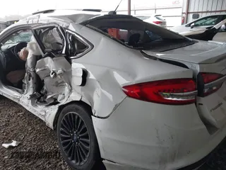 2017 Ford Fusion Hybrid Titanium with VIN 3FA6P0RU1HR322997, listed as a IAAI auction lot 41506630 with 263,589 mi miles and . Bid and sale history available at DreamBid. Image 6.