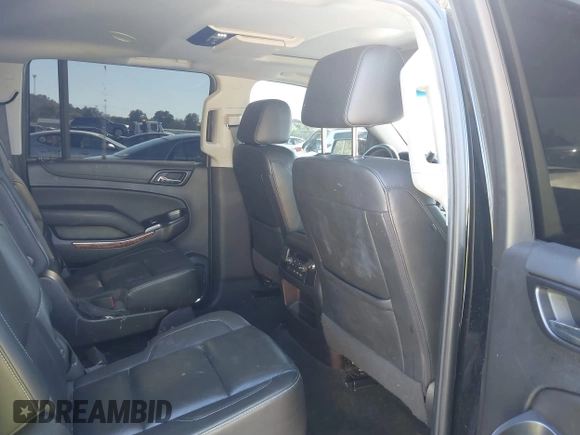2019 Chevrolet Suburban Premier with VIN 1GNSKJKJ1KR100936, listed as a IAAI auction lot 40489121 with 97,884 mi miles and . Bid and sale history available at DreamBid. Image 8.