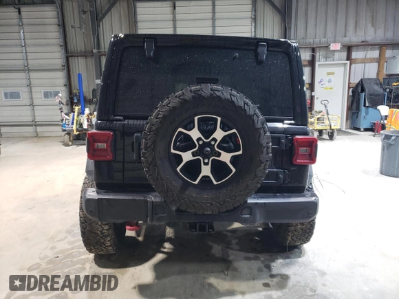 2021 Jeep Wrangler Unlimited Rubicon z VIN 1C4HJXFG7MW651772, wystawiony jako Copart lot #51651685 z przebiegiem 59 351 mil mil oraz Szkoda całkowita • Salvage title. Historia ofert i sprzedaży dostępna na DreamBid. Obrazek 6.