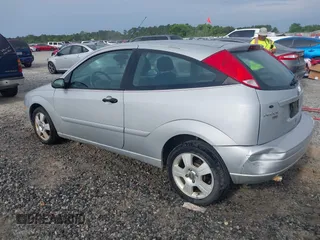 2006 Ford Focus S z VIN 1FAFP31NX6W160335, wystawiony jako IAAI lot #42377929 z przebiegiem 190 901 mil mil oraz . Historia ofert i sprzedaży dostępna na DreamBid. Obrazek 3.