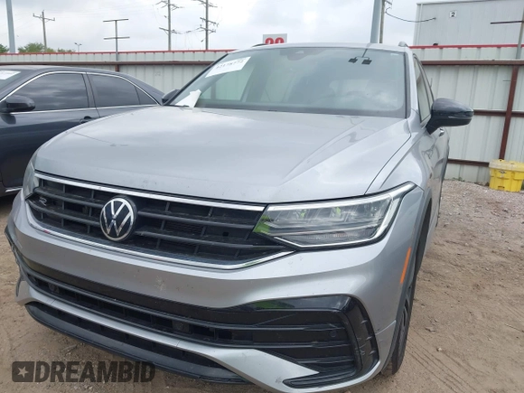 2022 Volkswagen Tiguan SE R-Line Black with VIN 3VVCB7AXXNM165748, listed as a IAAI auction lot 42178772 with 64,007 mi miles and . Bid and sale history available at DreamBid. Image 6.