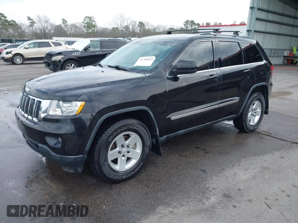 2012 Jeep Grand Cherokee Laredo with VIN 1C4RJEAG2CC259279, listed as a IAAI auction lot 41768024 with 185,161 mi miles. Bid and sale history available at carsss.com. Image 2.