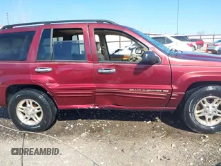 1999 Jeep Grand Cherokee Limited with VIN 1J4GW68N3XC770468, listed as a IAAI auction lot 41793600 with 65,277 mi miles. Bid and sale history available at carsss.com. Image 6.