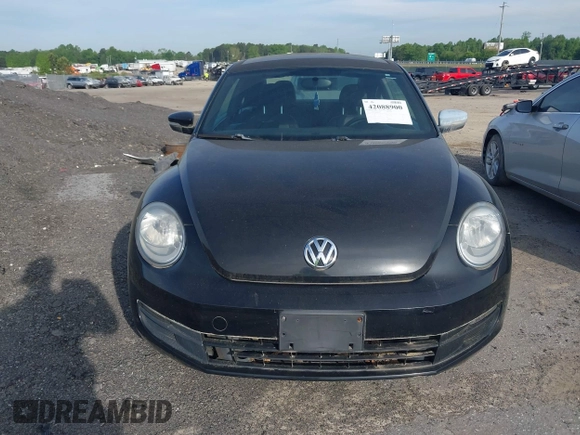 2013 Volkswagen Beetle 2.5L with VIN 3VWJP7AT1DM608370, listed as a IAAI auction lot 42088900 with Not Provided miles and . Bid and sale history available at DreamBid. Image 12.