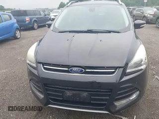 2015 Ford Escape Titanium z VIN 1FMCU0JX7FUB00462, wystawiony jako IAAI lot #42532943 z przebiegiem 88 623 mil mil oraz . Historia ofert i sprzedaży dostępna na DreamBid. Obrazek 6.