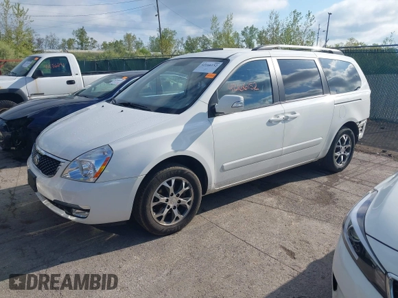 2014 Kia Sedona LX with VIN KNDMG4C75E6545483, listed as a IAAI auction lot 42166152 with 121,827 mi miles and . Bid and sale history available at carsss.com. Image 2.