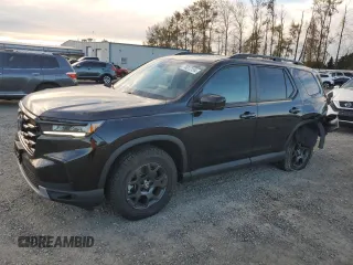 2023 Honda Pilot TrailSport with VIN 5FNYG1H63PB017335, listed as a Copart auction lot 75012154 with 5,870 mi miles and Salvage Title. Bid and sale history available at carsss.com. Image 1.