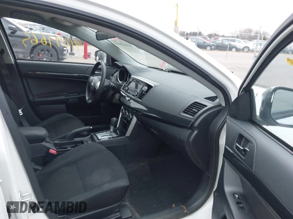 2016 Mitsubishi Lancer SE with VIN JA32V2FWXGU003619, listed as a IAAI auction lot 41041665 with 98,627 mi miles. Bid and sale history available at carsss.com. Image 5.