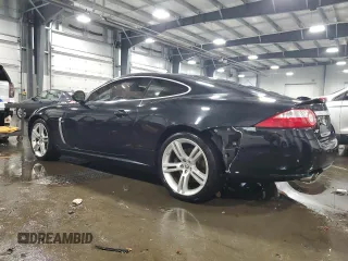 2007 Jaguar XK with VIN SAJWA43C479B18700, listed as a Copart auction lot 83377684 with 143,746 mi miles and Salvage Title. Bid and sale history available at carsss.com. Image 2.