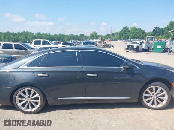 2013 Cadillac XTS Luxury z VIN 2G61P5S37D9110658, wystawiony jako IAAI lot #42196442 z przebiegiem 182 228 mil mil oraz . Historia ofert i sprzedaży dostępna na DreamBid. Obrazek 14.