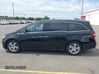 2012 Honda Odyssey Touring with VIN 5FNRL5H93CB121190, listed as a IAAI auction lot 42223998 with 154,358 mi miles and . Bid and sale history available at DreamBid. Image 14.