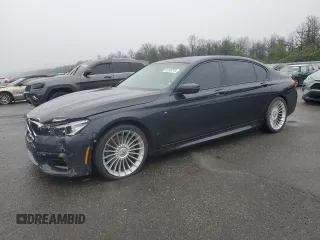 2016 BMW 7 Series 750i xDrive with VIN WBA7F2C55GG420433, listed as a Copart auction lot 61245215 with 102,682 mi miles and Salvage title. Bid and sale history available at DreamBid. Image 1.
