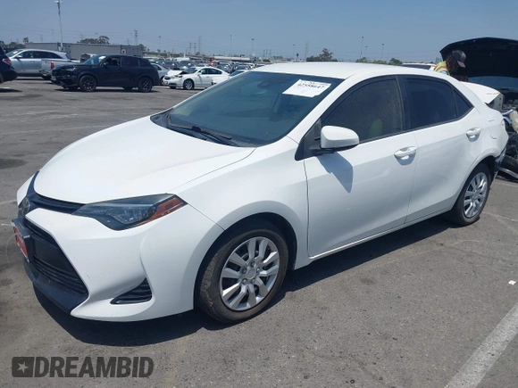 2018 Toyota Corolla L with VIN 5YFBURHE7JP810444, listed as a IAAI auction lot 42558647 with 74,794 mi miles and . Bid and sale history available at DreamBid. Image 2.