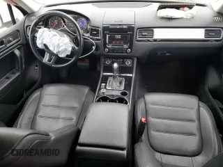 2014 Volkswagen Touareg Sport with VIN WVGEF9BP3ED005921, listed as a Copart auction lot 77372514 with 156,753 mi miles and Salvage Title. Bid and sale history available at DreamBid. Image 8.