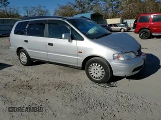 1997 Honda Odyssey with VIN RA11239041, listed as a Copart auction lot 85819024 with 79,952 mi miles and Salvage title. Bid and sale history available at DreamBid. Image 12.