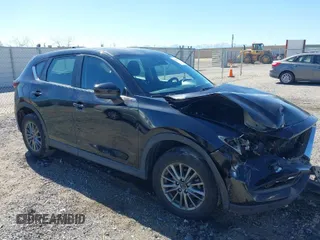 2017 Mazda CX-5 Sport with VIN JM3KFBBL2H0144792, listed as a IAAI auction lot 41654031 with 77,107 mi miles. Bid and sale history available at carsss.com. Image 1.