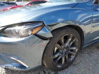 2016 Mazda Mazda6 i Grand Touring with VIN JM1GJ1W51G1436977, listed as a IAAI auction lot 42097363 with 128,941 mi miles. Bid and sale history available at carsss.com. Image 6.
