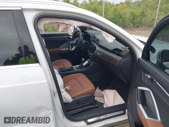 2022 Audi Q3 S line Premium Plus with VIN WA1EECF38N1031860, listed as a IAAI auction lot 42345075 with 27,171 mi miles and . Bid and sale history available at DreamBid. Image 5.