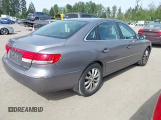 2007 Hyundai Azera SE z VIN KMHFC46F57A141280, wystawiony jako IAAI lot #42214462 z przebiegiem 105 476 mil mil oraz . Historia ofert i sprzedaży dostępna na DreamBid. Obrazek 4.