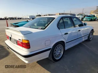 1991 BMW M5 z VIN WBSHD9319MBK05979, wystawiony jako Copart lot #85645534 z przebiegiem 138 219 mil mil oraz Tytuł czysty. Historia ofert i sprzedaży dostępna na DreamBid. Obrazek 3.