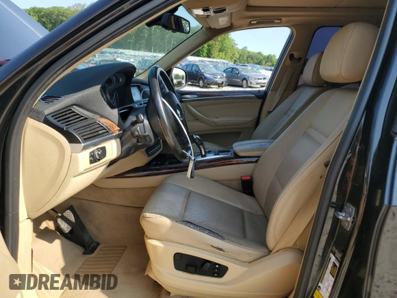 2012 BMW X5 35i with VIN 5UXZV4C57CL756062, listed as a Copart auction lot 65752145 with 160,860 mi miles and Clean title. Bid and sale history available at DreamBid. Image 7.