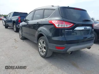 2014 Ford Escape Titanium with VIN 1FMCU0JX5EUB43194, listed as a IAAI auction lot 42084883 with 71,819 mi miles. Bid and sale history available at carsss.com. Image 3.