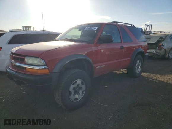 2004 Chevrolet Blazer LS z VIN 1GNCT18X34K141674, wystawiony jako Copart lot #85500954 z przebiegiem Nie podano mil oraz Czysty tytuł • Clean title. Historia ofert i sprzedaży dostępna na DreamBid. Obrazek 1.