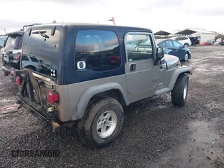 2004 Jeep Wrangler Sport with VIN 1J4FA49S94P711531, listed as a IAAI auction lot 41306863 with 143,720 mi miles and . Bid and sale history available at DreamBid. Image 4.